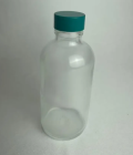 FRASCO DE VIDRO, COR INCOLOR, COM TAMPA DE ROSCA VERDE DE TEFLON CAP. 100ML